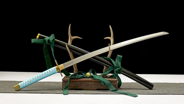 Bleach Hyōrinmaru katana — steel blade, ice-blue cotton ito handle, star-shaped iron tsuba, black saya with green ribbon sageo, on antler and wood stand
