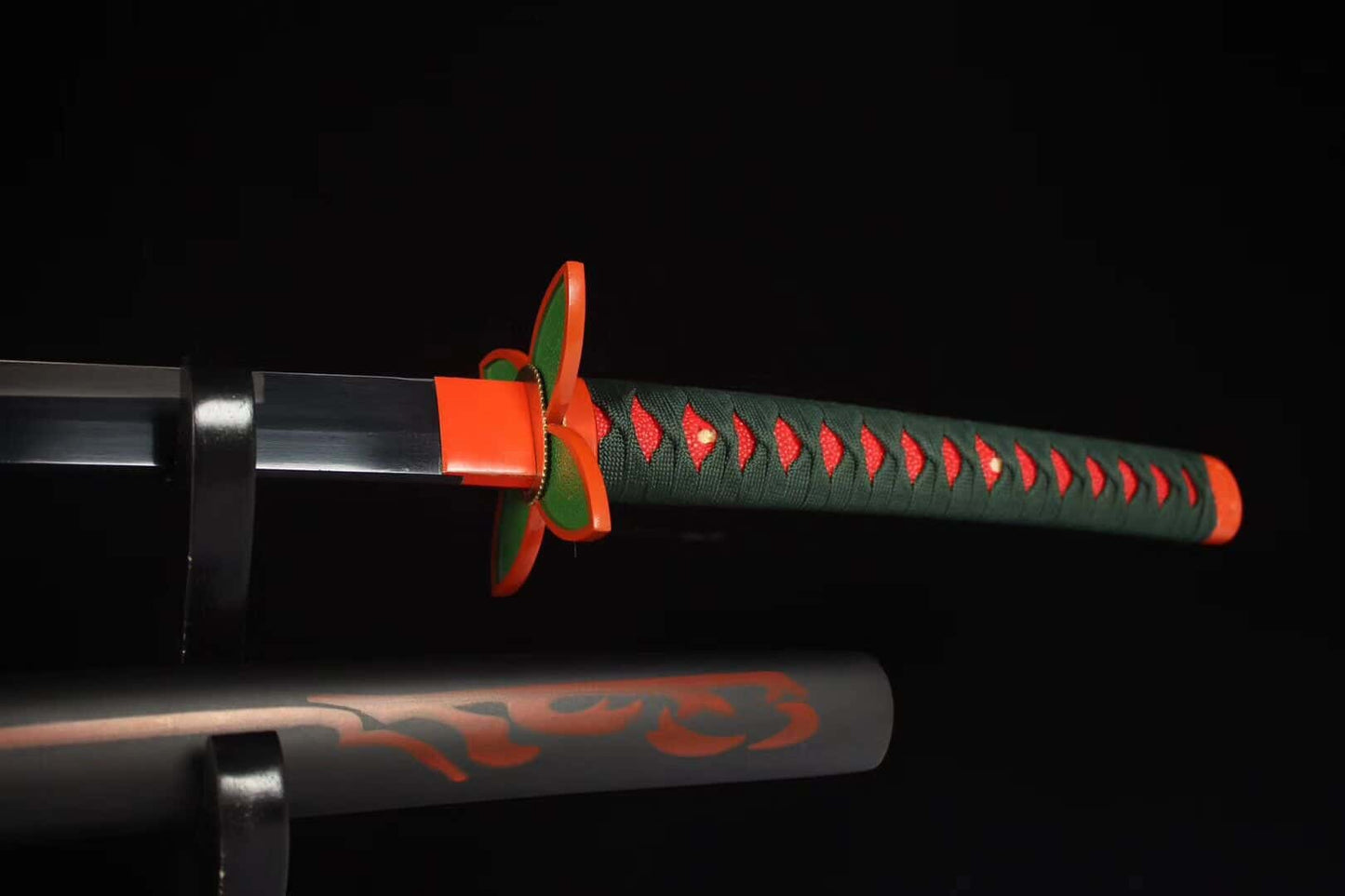 Orange butterfly-style tsuba detail on Shinobu’s katana